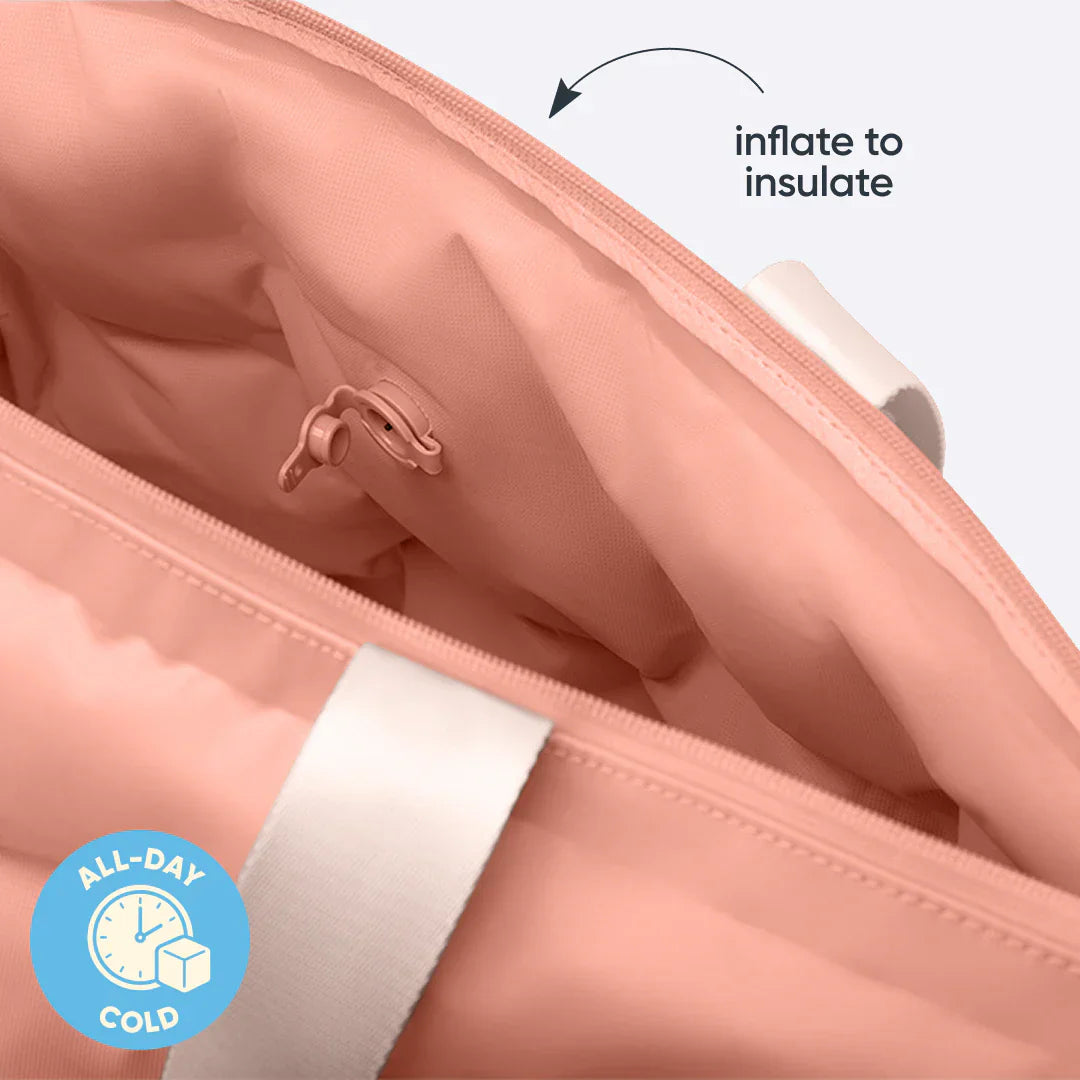Interior view of the Owala Cloud Insulated Tote in Rosewood showing the peach pink lining, peach inflation valve, and cream handle attachment, with text overlay reading "inflate to insulate" and an "ALL-DAY COLD" badge